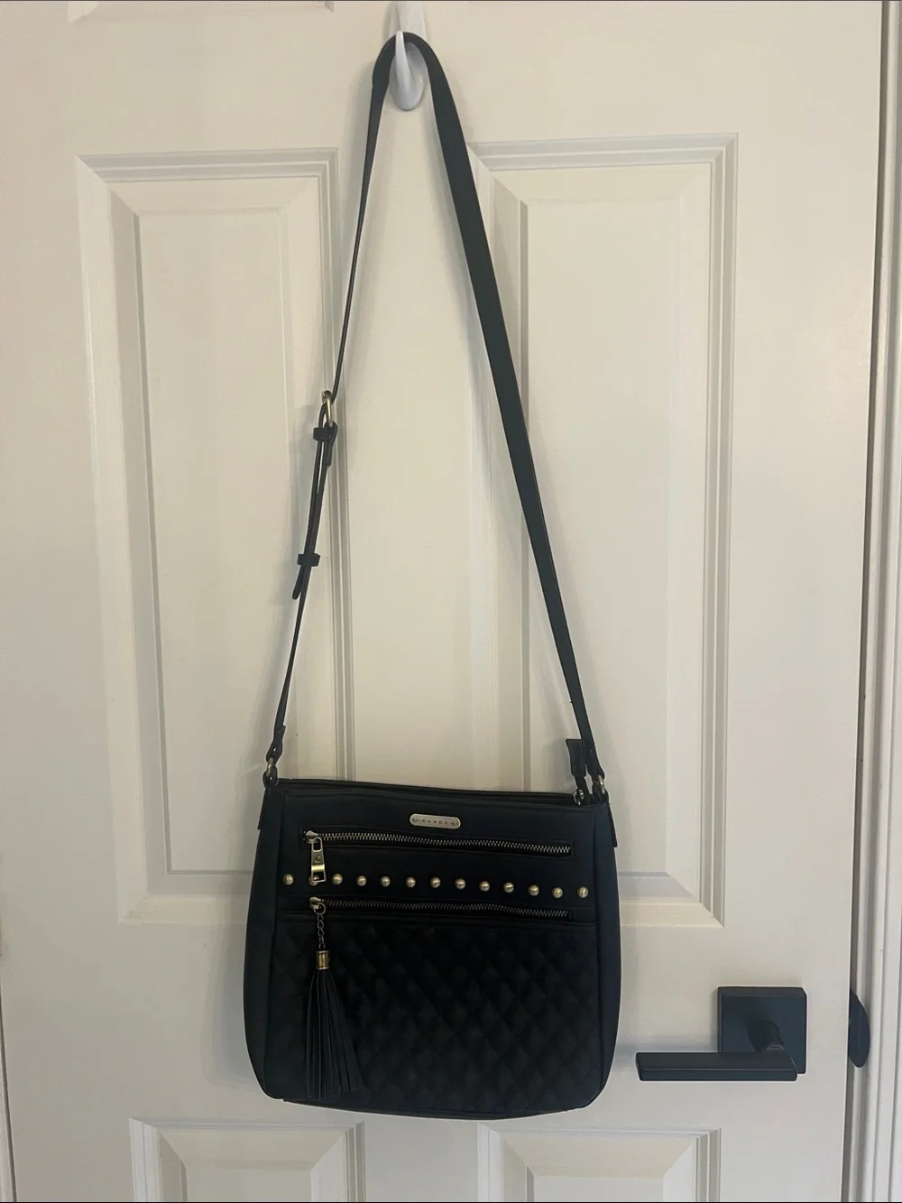 Black Quilted Crossbody Bag with Tassel and Stud Details
